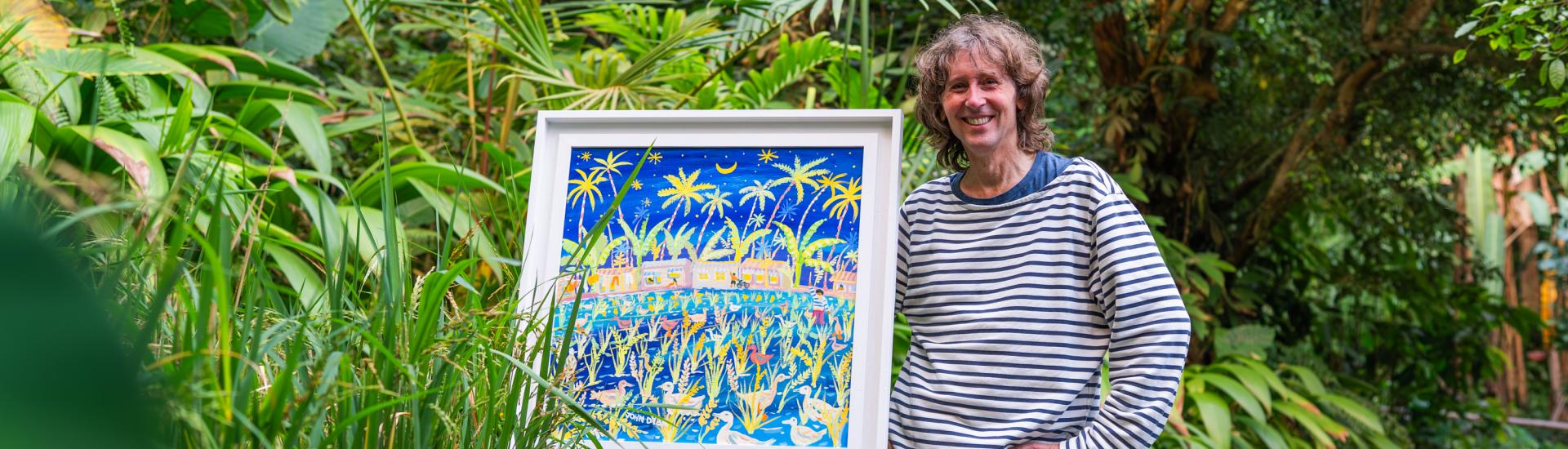 John Dyer with artwork in Rainforest Biome